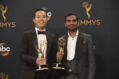Alan Yang and Aziz Ansari pose for photographers after winning their Emmys