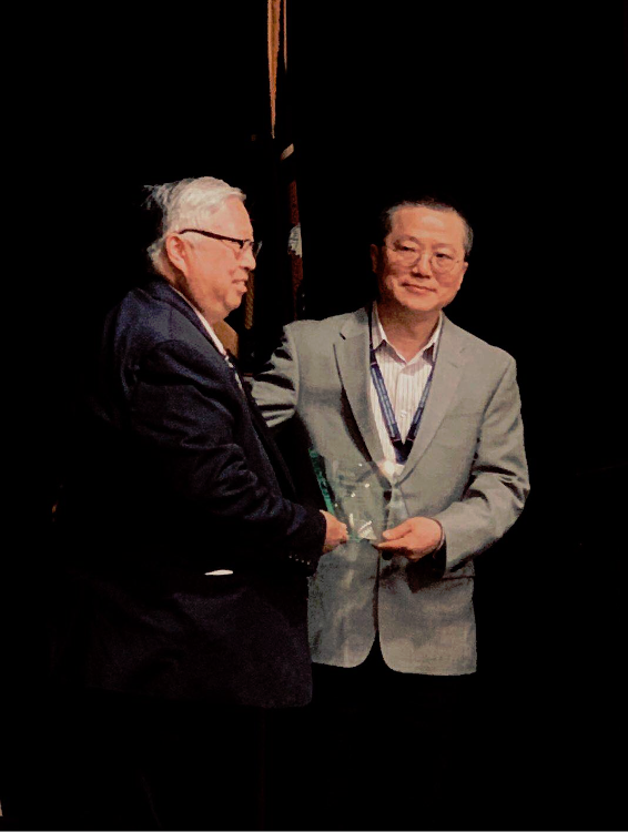 Zhi Lin with Judge Michael Kwan 