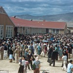 At midday on Sept. 21, 1943, a crowd of about 4,000 people gather at the high school to send off 434 detainees departing for the Tule Lake Segregation Center in California after the government deemed them ‘disloyal’. Photo by Bill Manbo