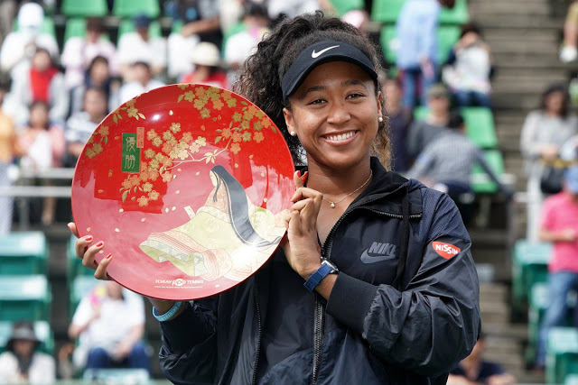 Naomi Osaka holds aloft the trophy for the Toray Pan Pacific Open held in Osaka, Japan.