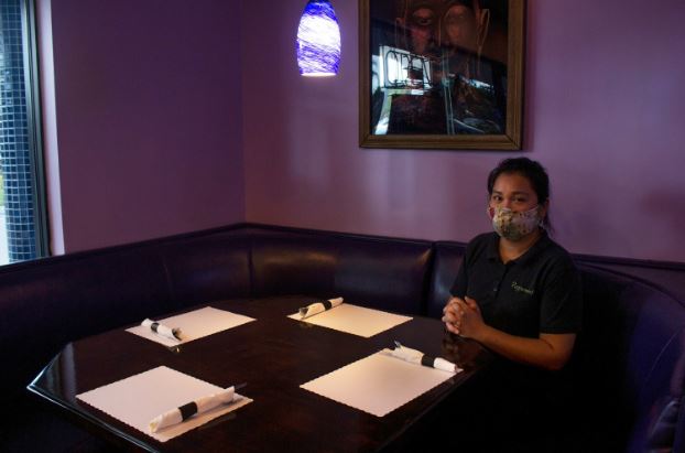 Family employee Tammi Nitibhon relaxes at the Peppermint Thai in Palm Beach, Florida