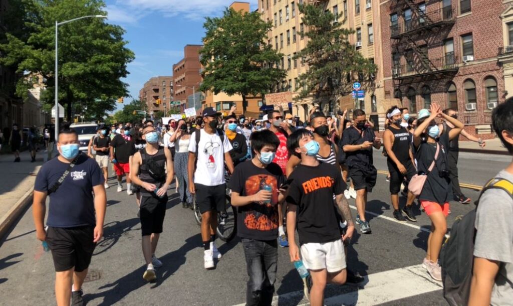 Asian unity Rally Protesters March by Ross Killion