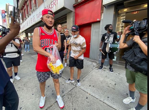 China Mac offers free food to shoe passing by on Friday in Manhattan Chinatown