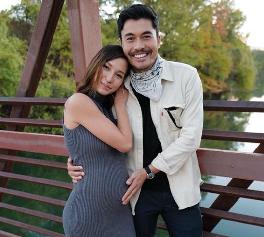 Liv Lo reveals her baby bump with husband Henry Golding