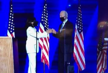 Kamala Harris greets Joe Biden before he gives his victory speech