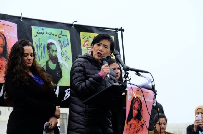 Description: Representative Judy Chu, alongside our allies Darakshan Raja and Maha Hilal (both from Justice for Muslims Collective), speaking at a #NoMuslimBanEver protest outside the Supreme Court in 2018.