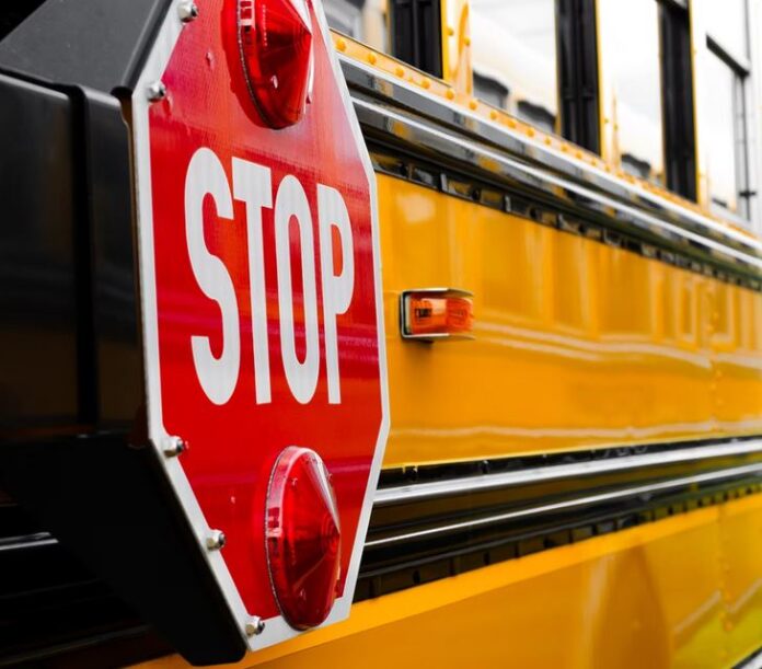 stop sign on side of school bus