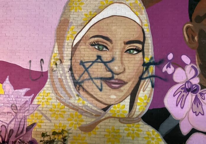 Swastika painted over a mural meant to celebrate Muslims