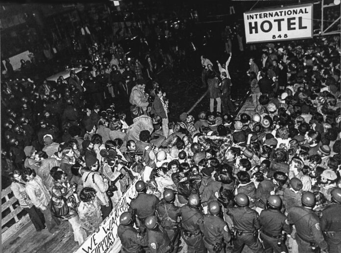 protesters locked arm in arm battle sheriff deputies trying to evict tenants from the International Hotel in 1977
