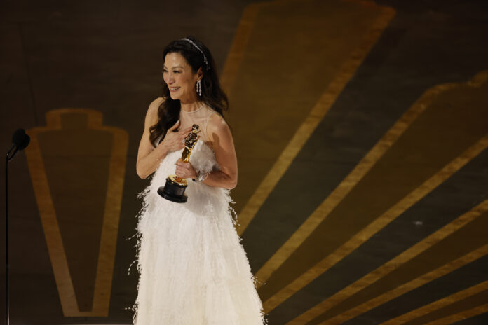 Michelle Yeoh accepts her Oscar for Best Actress
