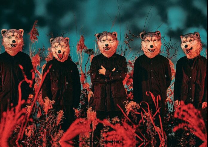 Five band members all wearing wolf masks