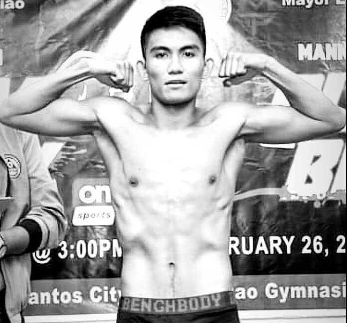 Boxer Kenneth Egano flexes his muscles in this Facebook profile picture showing him shirtless in boxing shorts