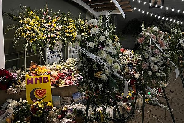 Flowers adorn a memorial for the victims of the Half Moon Bay Shooting in January 2o23