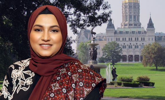 State Rep Maryam Khan stands in front of Connecticut State Capitol