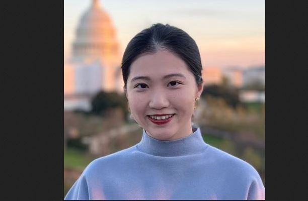 Anna Kwok with the U.S. Capitol building in the background