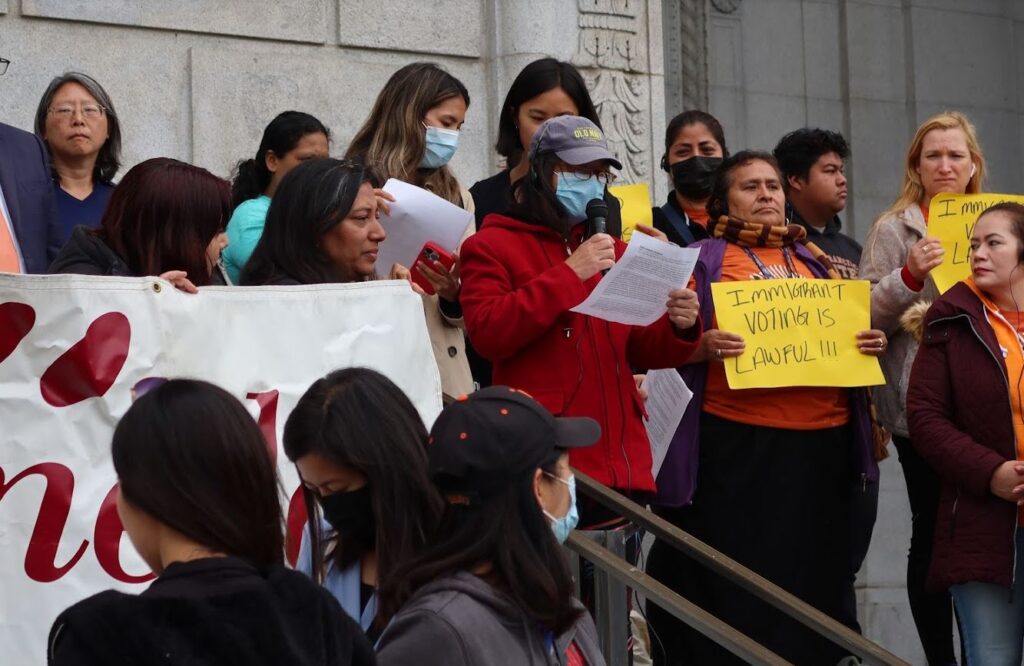 A coalition of community groups rallies in support of non-citizens voting in school board elections