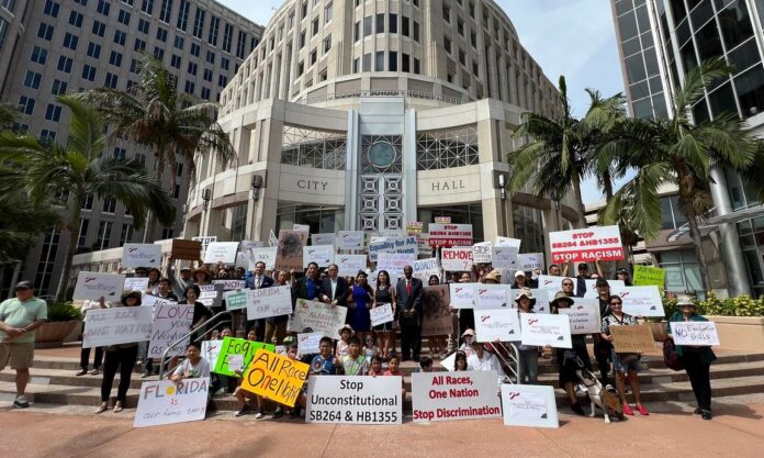 Community protests in Florida against an anti-Alien land bill