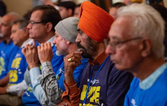 Concerned citizens look on intently during a committee hearing in California's Assembly on the caste discrimination bill