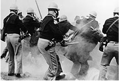 Police billy club and tear gas civil rights protesters in Alabama in March 1965