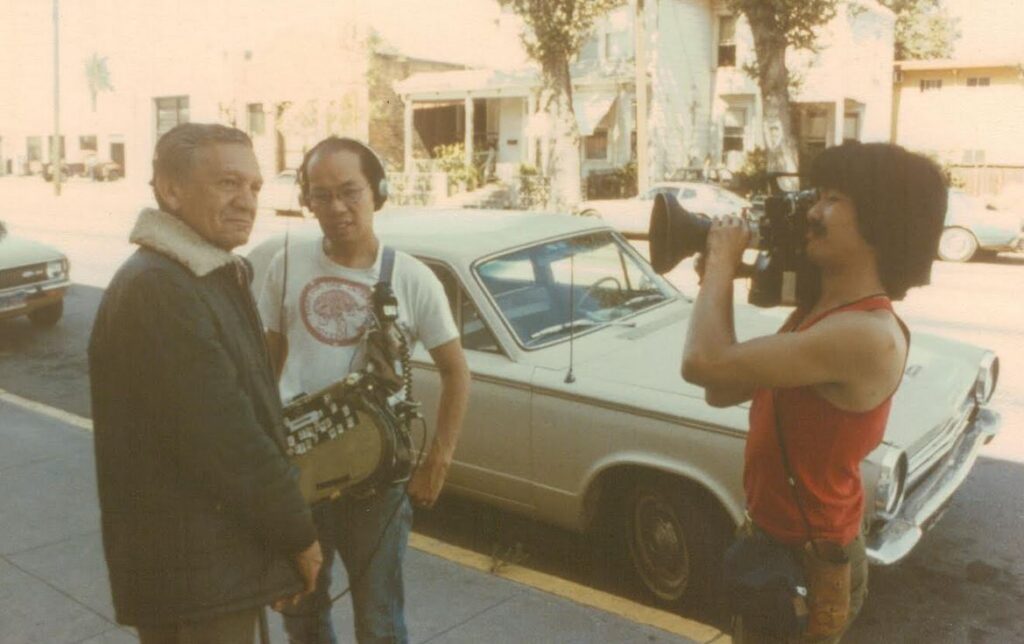 Chris Chow is seen here conducting an interview while Curtis Choy films it
