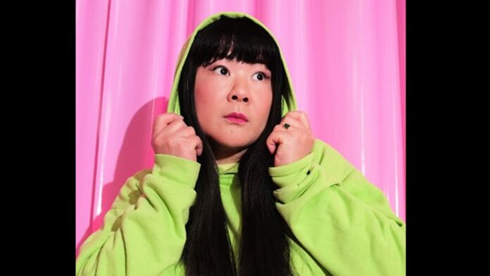Jenny Yang in a hoodie