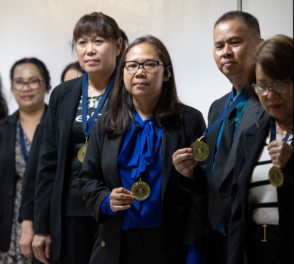 Some of the El Monte Thai garment workers at the U.S. Department of Labor's Hall of Honor. Photo Credit: Alyson Fligg/U.S. Department of Labor