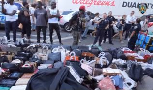Some of the three truckloads of counterfeit goods confiscated in New York's Chinatown