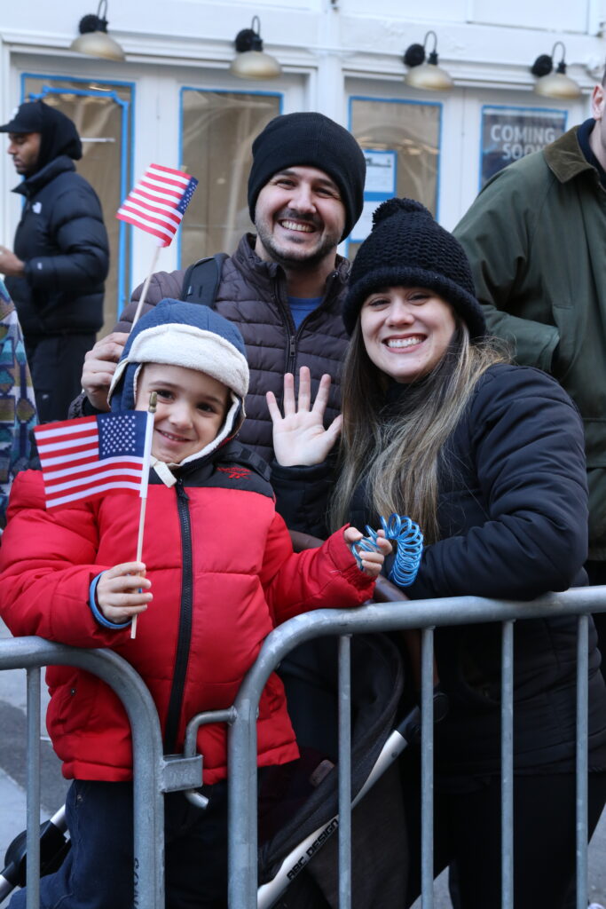 Family of spectators at the NYC Veterans Day Parade. Photo by Shirley L. Ng