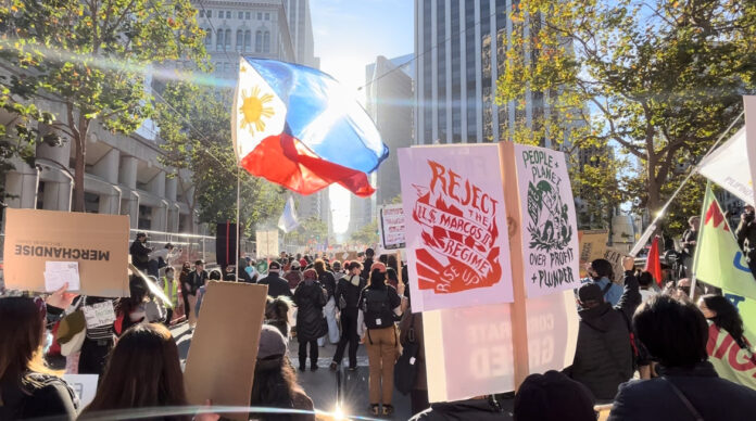 Amid one of many Filipino contingents of the No to APEC Coalition protest attended by thousands in on Sunday, Nov. 12 in downtown San Francisco. Jia H. Jung/AsAmNews No to APEC, No 2 APEC, Anti-APEC, APEC 2023, anti-APEC protest
