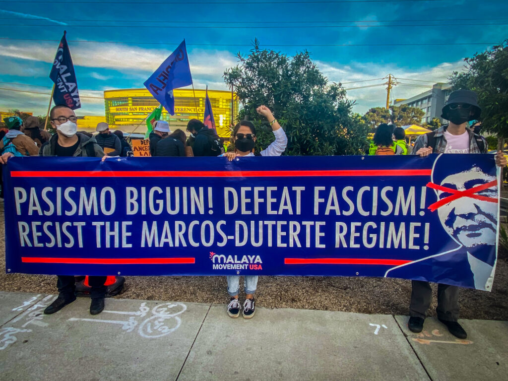 A banner opposes the Marcos-Duterte tandem of Philippine president Ferdinand Marcos Jr. and Philippine vice president Sara Duterte, daughter of former president Rodrigo Duterte. Joseph E./Malaya Movement, APEC 2023, anti-APEC, no to APEC, anti-Marcos