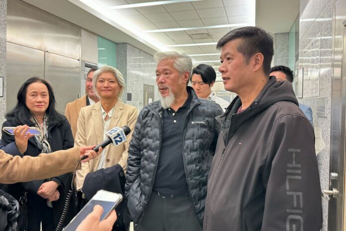 Tingduo Lei (Right) is interviewed with his spokesperson Karlin Chan