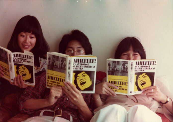 Nancy Wong, Shawn Hsu Wong, and Cyn Zarco pictured reading the Aiiieeeee! anthology in San Francisco in 1976. Personal collection of Nancy Wong