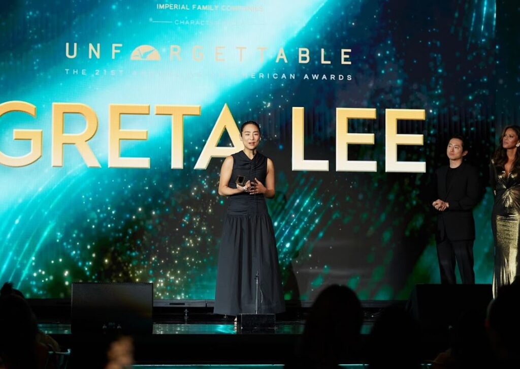 Greta Lee of Past Lives accepts an award for directing at the Unforgettable Awards in Los Angeles. 