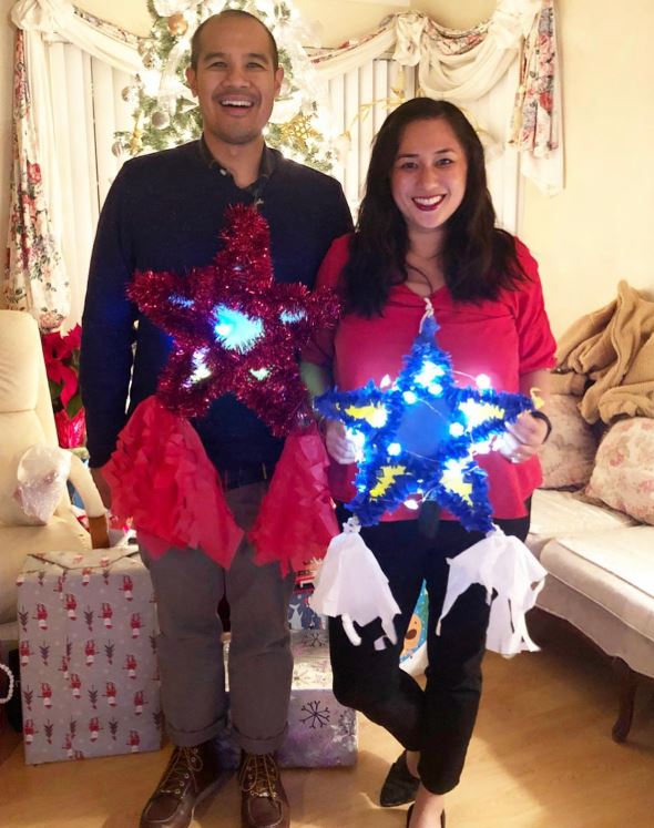 Indira Collado and her husband, Eric, with their homemade parols. Photo courtesy of Indira Collado.