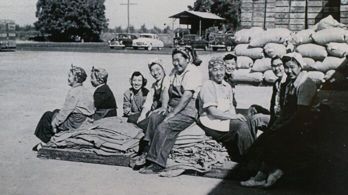 A half dozen women from the Work crew at the Cortez Growers Association enjoy their break