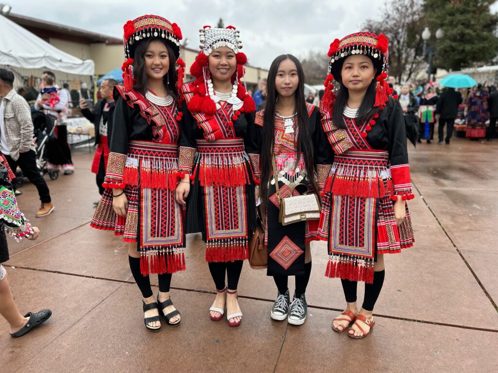 A group of friends and cousins at the Fresno Hmong Cultural New Year Celebration. Photo by Jia H. Jung