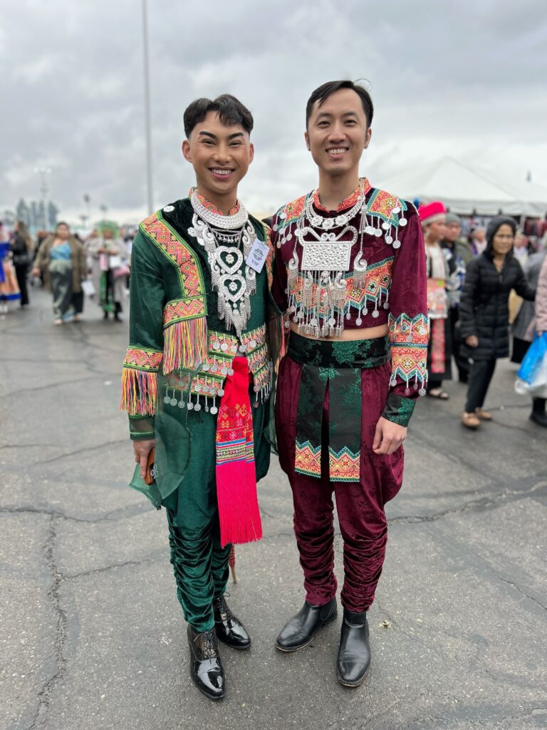 Two young men and alums of former dance competitions in their finest at the Fresno Hmong Cultural New Year Celebration. Photo by Jia H. Jung