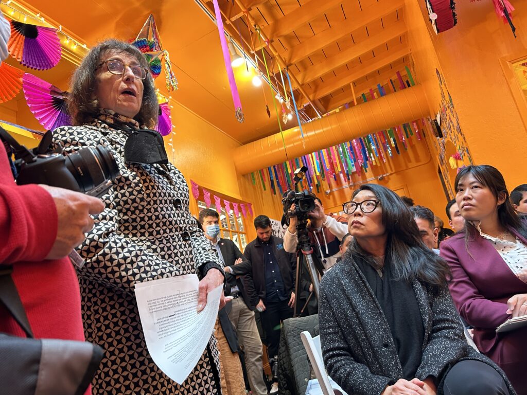 A Democratic advocate speaks about local initiatives to connect farm workers with elected officials as Cynthia Choi, co-executive director of Chinese For Affirmative Action (left) and Ting Wu, AA and NHPI Special Advisor of The White House Office of the Chief of Staff (right) look on. Half moon bay shootings roundtable, Jan. 23, 2024