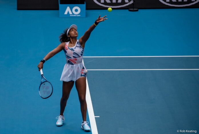 Naomi Osaka servces in the Australian Open 2020