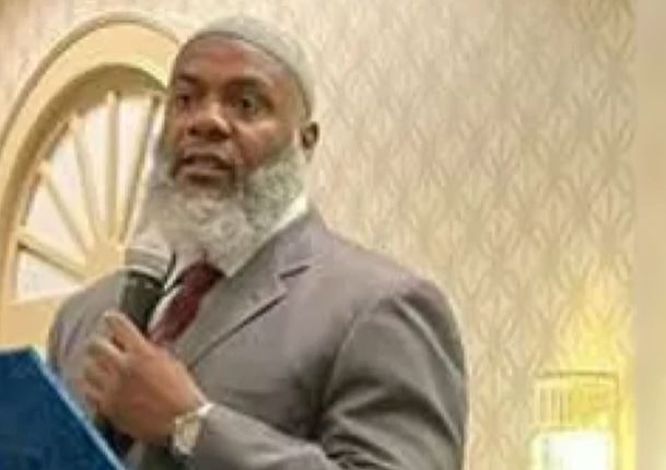 Hassan Sharif holds a microphone during a recent sermon