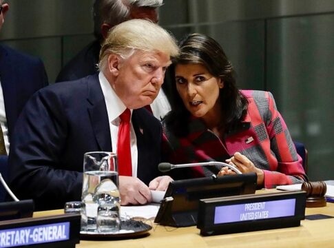 Donald Trump and Nikki Haley speak with each other at the United Nations in 2018