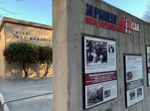 An information display in former Japantown of Sacramento with a building in the background.