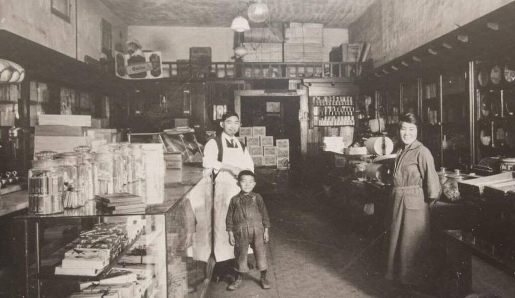 Sugimatsu Ikeda, grandfather, Sakino Ikeda, grandmother, and Roy Ikeda, uncle of Lynn Ikeda (1920) via Kogetsu-Do Confectionery.