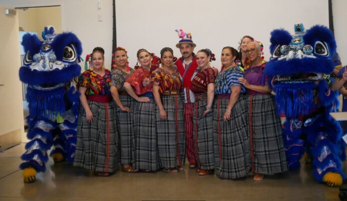 Chinese lion dancers and Mexican dancers