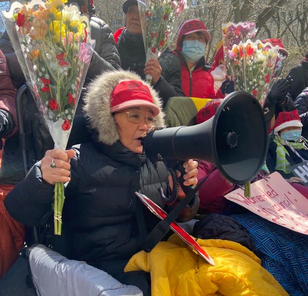 A hunger striker is presented with flowers after 6 days without food and only water.