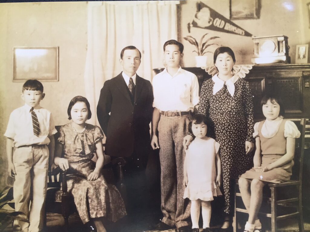 A family poses in their living room.