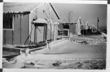 Snow covers barracks at Amache concentration camp in Colorado.