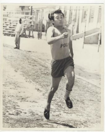 George Nakano competes in track and field
