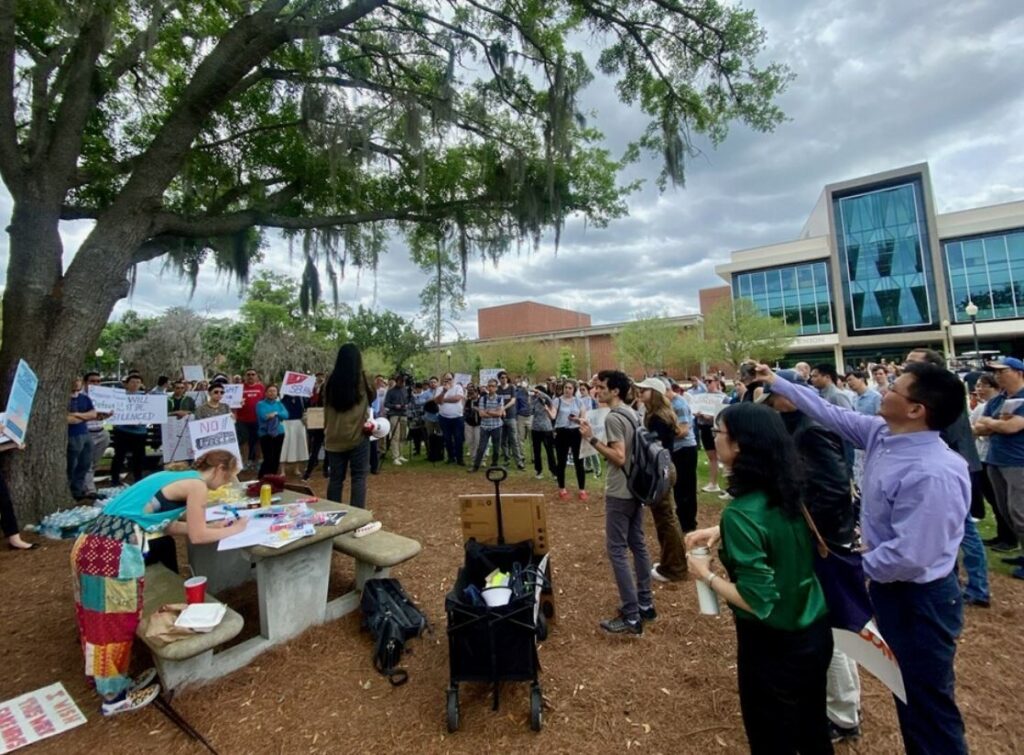 More than 100 protestors at the University of Florida speak out against a law that bans partnership between the campus and people from China and 6 other countries.