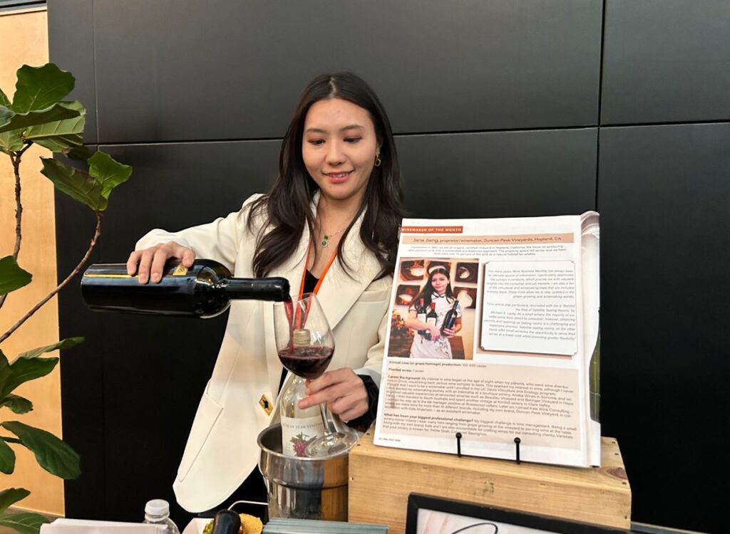 Jane Jiang of Duncan Peak Vineyard pours a glass of wine.